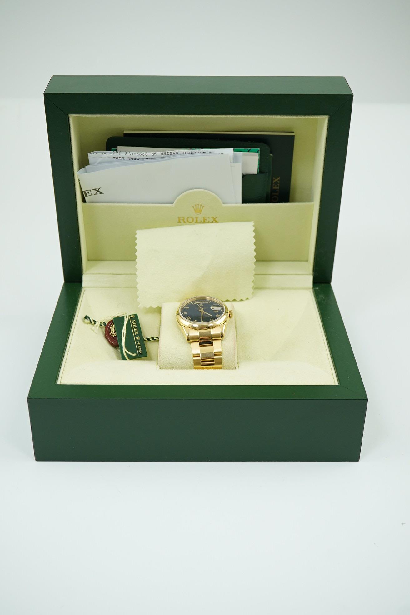 A gentleman's 2004 18ct gold Rolex Oyster Perpetual Day-Date wrist watch, on an 18ct gold Rolex bracelet with deployment clasp